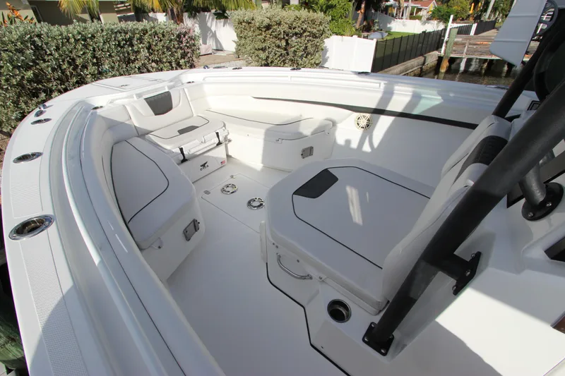 Slide: The Image of 2020 Wellcraft 302 Fisherman boat interior with seating and storage compartments. - 36
