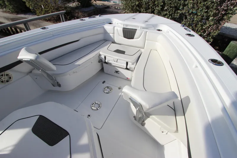 Slide: The Image of 2020 Wellcraft 302 Fisherman boat interior with seating and storage compartments. - 37