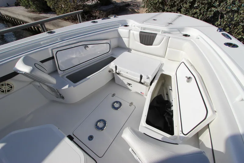 Slide: The Image of 2020 Wellcraft 302 Fisherman boat interior with storage compartments and seating. - 38
