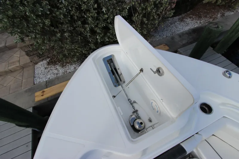 Slide: The Image of 2020 Wellcraft 302 Fisherman boat storage compartment with open lid. - 42
