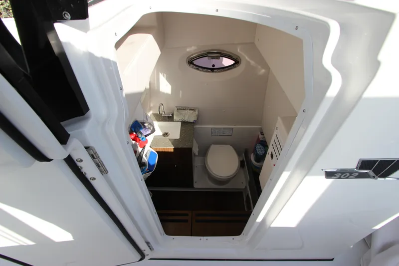 Slide: The Image of Interior cabin of 2020 Wellcraft 302 Fisherman boat with toilet and sink. - 48