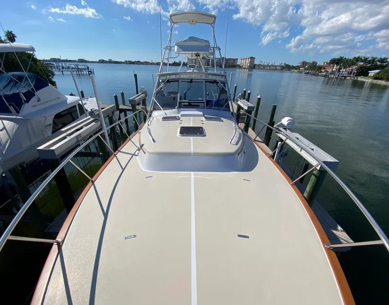 Slide: The Image of 2000 Little Harbor 42 Whisper Jet docked at a marina on a sunny day. - 18