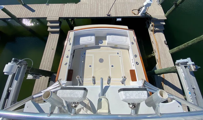 Slide: The Image of 2000 Little Harbor 42 Whisper Jet boat docked, aerial view of spacious deck. - 19
