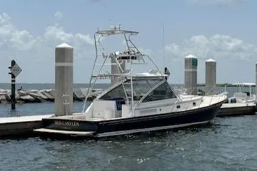 Slide: The Image of Little Harbor 42 Whisper Jet 2000 docked at a marina on a sunny day. - 2