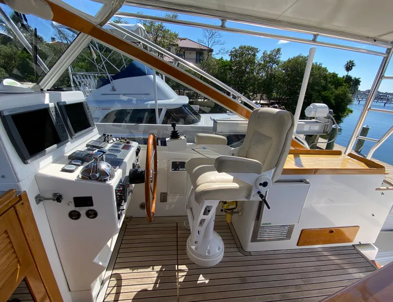 Slide: The Image of 2000 Little Harbor 42 Whisper Jet helm station with modern controls and comfortable captain's chair. - 22