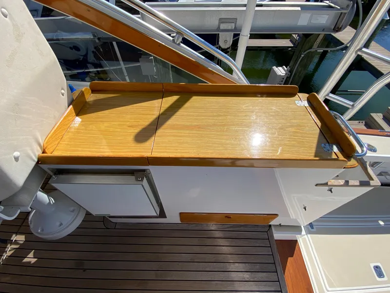 Slide: The Image of Wooden console on 2000 Little Harbor 42 Whisper Jet boat. - 24