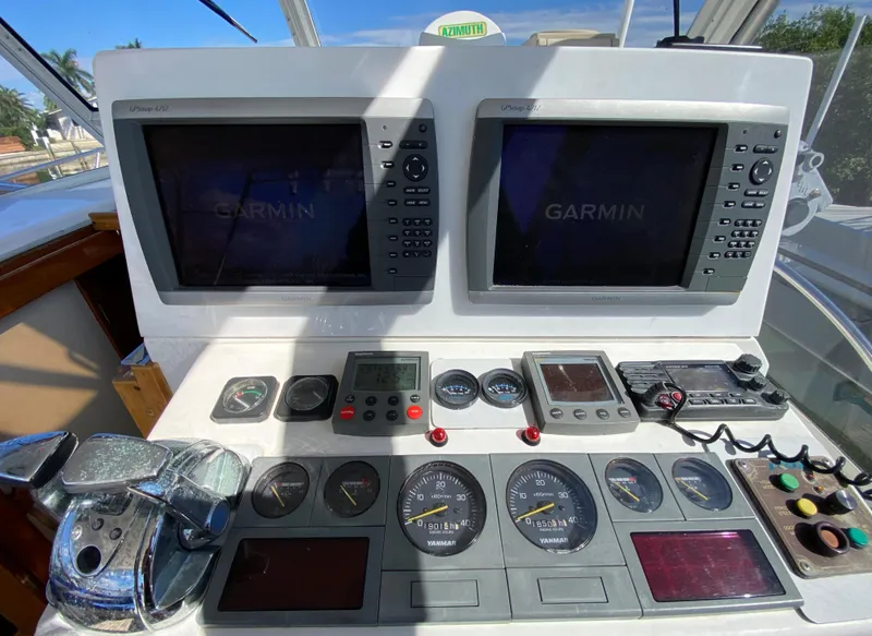 Slide: The Image of Helm station of 2000 Little Harbor 42 Whisper Jet with Garmin navigation displays. - 27