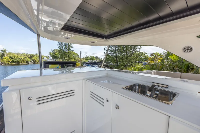 Slide: The Image of 2024 Astondoa Flybridge yacht with outdoor kitchen and sink. - 21