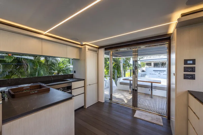 Slide: The Image of Modern kitchen area on the 2024 Astondoa Flybridge yacht with outdoor seating. - 33