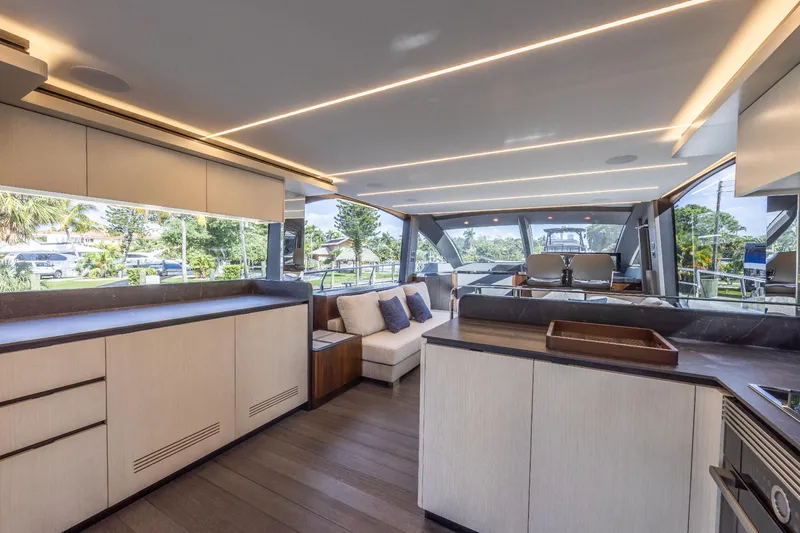 Slide: The Image of Luxurious interior of the 2024 Astondoa Flybridge yacht with modern furnishings and panoramic windows. - 35