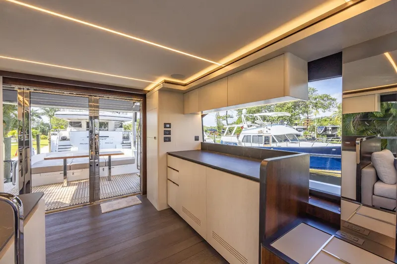 Slide: The Image of 2024 Astondoa Flybridge yacht interior with modern kitchen and outdoor seating area. - 36