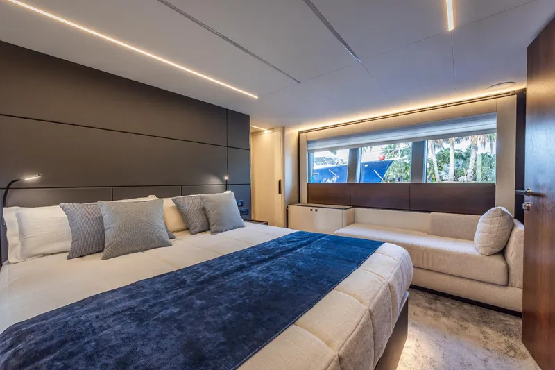 Slide: The Image of Luxurious bedroom in 2024 Astondoa Flybridge yacht with modern decor and large window. - 43