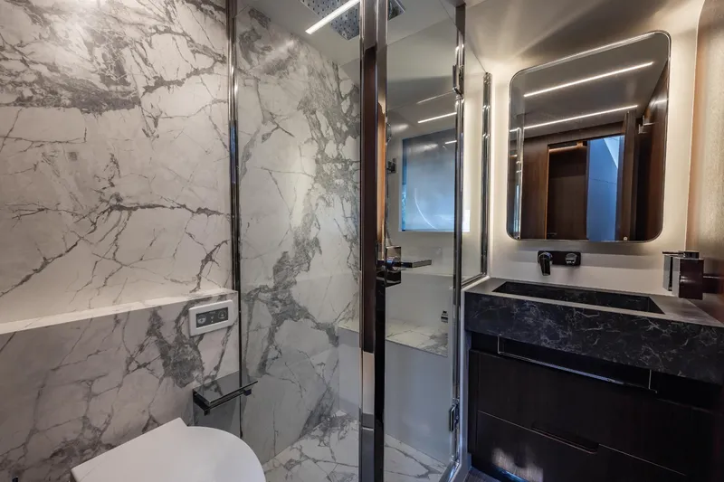 Slide: The Image of Luxurious bathroom in 2024 Astondoa Flybridge yacht with marble walls and modern fixtures. - 47