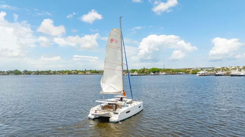 Slide: The Image of 2018 Fountaine Pajot Lucia 40 catamaran sailing on a sunny day. - 1