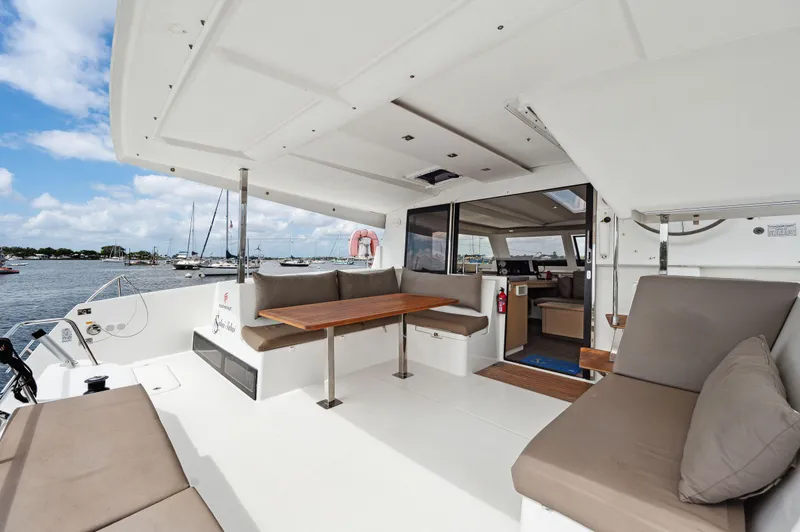 Slide: The Image of Spacious deck of 2018 Fountaine Pajot Lucia 40 catamaran with comfortable seating and ocean view. - 27