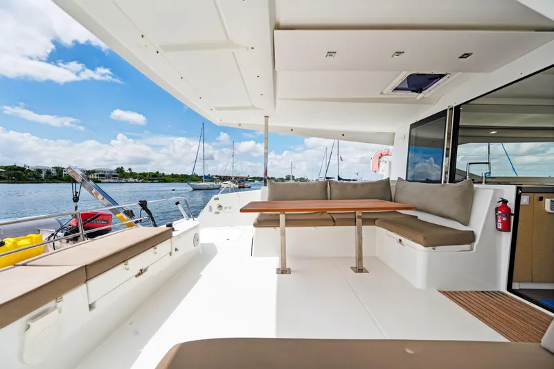 Slide: The Image of Spacious deck of 2018 Fountaine Pajot Lucia 40 catamaran with seating and table. - 29