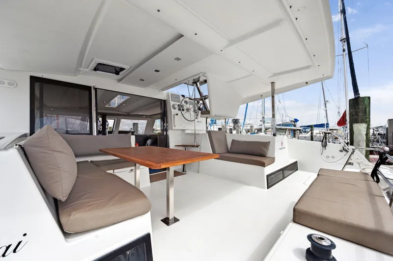 Slide: The Image of Spacious deck of 2018 Fountaine Pajot Lucia 40 catamaran with comfortable seating and table. - 3