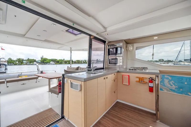 Slide: The Image of Modern kitchen interior of 2018 Fountaine Pajot Lucia 40 catamaran with waterfront view. - 30