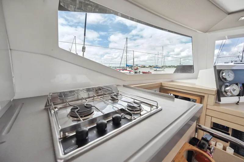 Slide: The Image of Modern kitchen area on 2018 Fountaine Pajot Lucia 40 catamaran with marina view. - 31