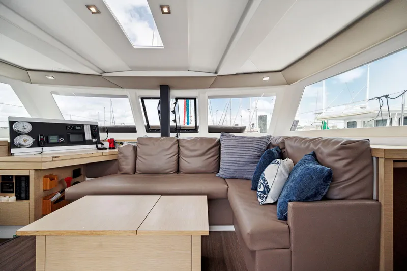Slide: The Image of Interior of 2018 Fountaine Pajot Lucia 40 catamaran with modern seating and navigation equipment. - 33