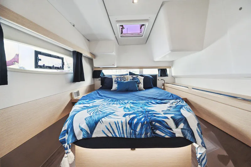 Slide: The Image of Luxurious cabin interior of 2018 Fountaine Pajot Lucia 40 catamaran with blue bedding. - 40