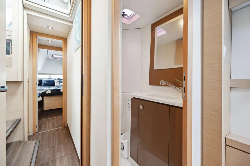 Slide: The Image of Interior of 2018 Fountaine Pajot Lucia 40 yacht, featuring modern bathroom and cozy cabin. - 47