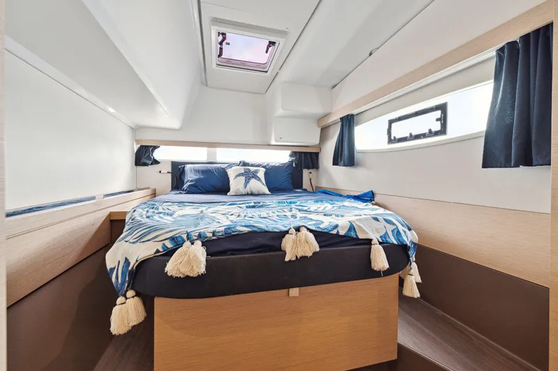 Slide: The Image of Luxurious cabin interior of 2018 Fountaine Pajot Lucia 40 catamaran with cozy bedding. - 48