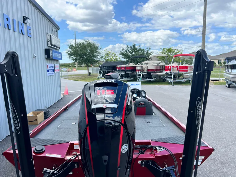 Slide: The Image of 2022 Ranger RT188 boat with Mercury 115 engine at a marine dealership. - 12