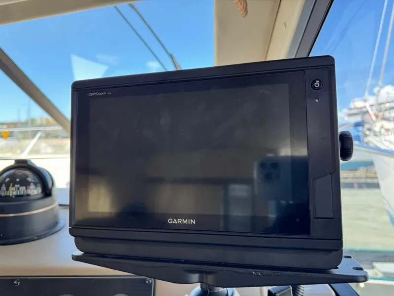 Slide: The Image of Garmin GPS device on 2000 Bayliner 3388 Motor Yacht dashboard. - 13