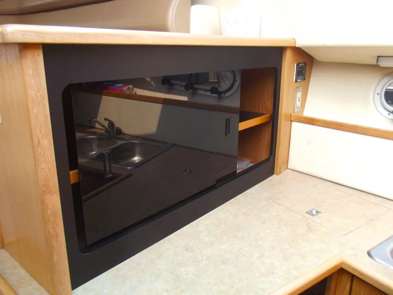 Slide: The Image of 2000 Bayliner 3388 Motor Yacht interior with microwave and sink. - 16