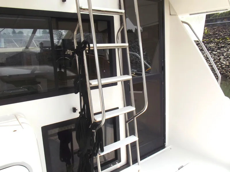 Slide: The Image of Stainless steel ladder on 2000 Bayliner 3388 Motor Yacht, near cabin entrance. - 5