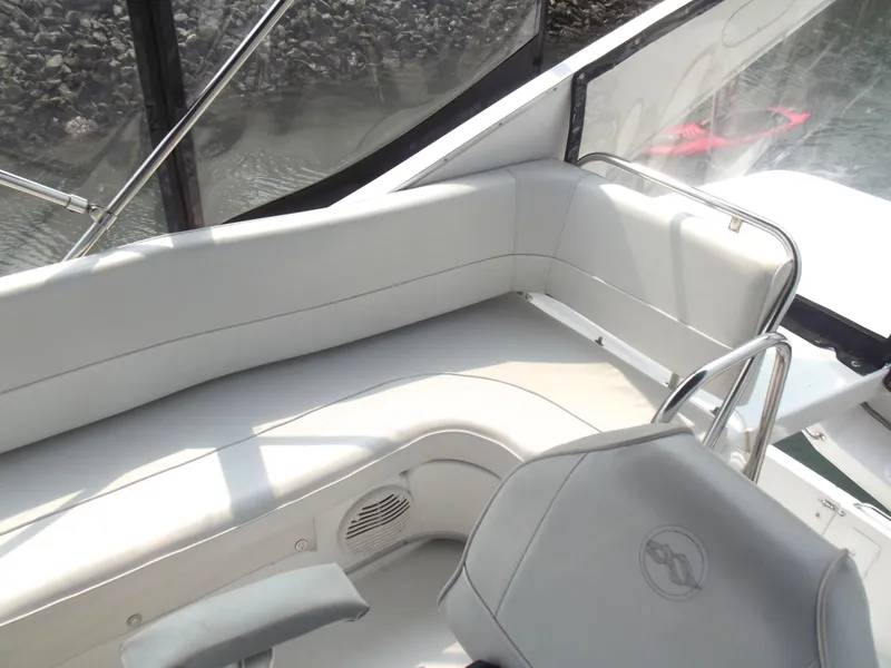 Slide: The Image of 2000 Bayliner 3388 Motor Yacht interior with gray seating and helm. - 7