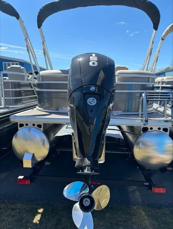Slide: The Image of 2022 Sun Tracker PB 24 DLX pontoon boat with powerful outboard motor. - 3