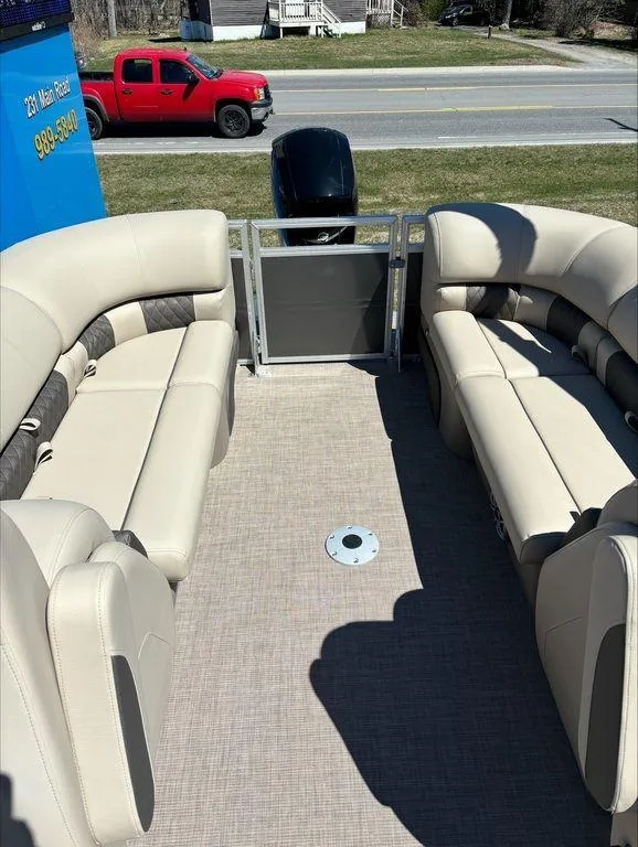 Slide: The Image of 2022 Sun Tracker PB 24 DLX pontoon boat interior with beige seating. - 7