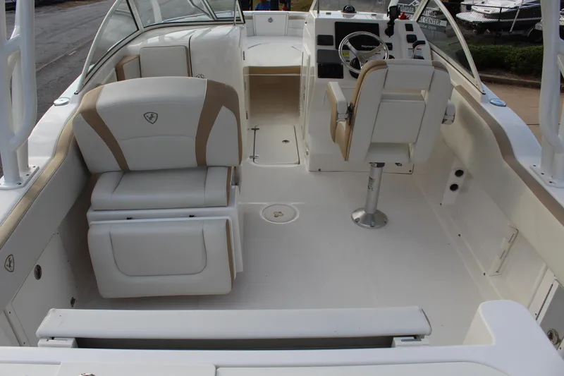 Slide: The Image of Interior of a 2018 Century 24 Resorter boat with beige seating. - 14