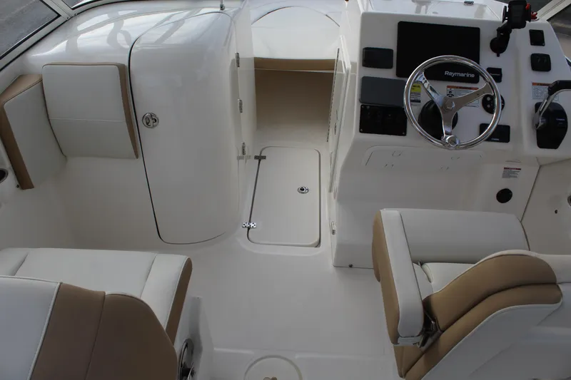 Slide: The Image of Interior of a 2018 Century 24 Resorter boat with steering console. - 21
