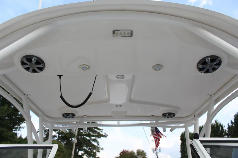 Slide: The Image of 2018 Century 24 Resorter boat deck with speakers and lighting. - 24