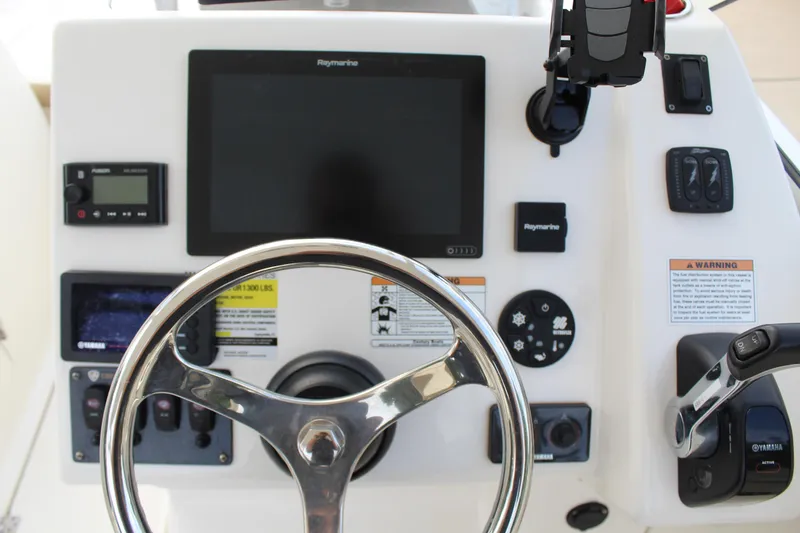 Slide: The Image of Century 24 Resorter 2018 helm with Raymarine display and controls. - 8