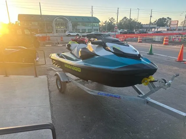 Slide: The Image of 2024 Sea-Doo Waverunner GTI on trailer at sunset in parking lot. - 10