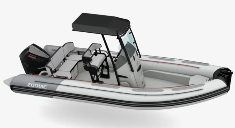 Slide: The Image of 2024 Zodiac Open 6.5 inflatable boat with center console and seating. - 2