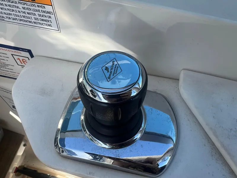 Slide: The Image of Joystick control on a 2014 Sea Ray 350 Sundancer boat. - 16