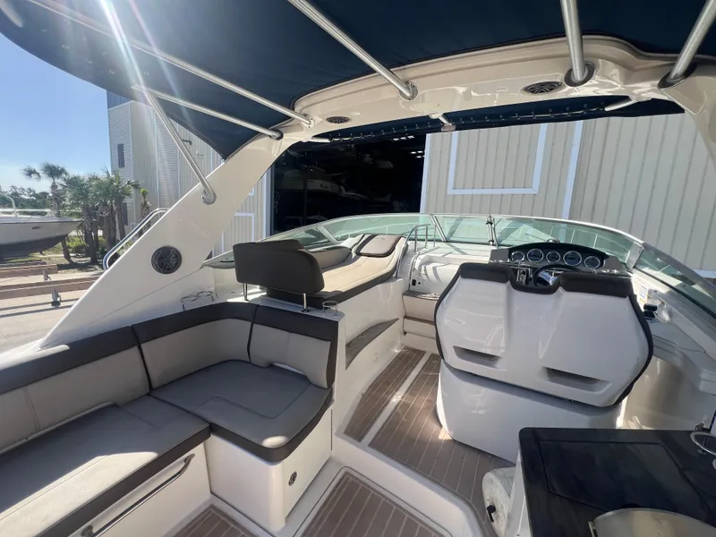 Slide: The Image of Interior of 2014 Sea Ray 350 Sundancer boat with seating and helm station. - 17