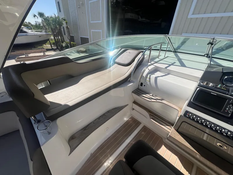 Slide: The Image of Interior cockpit of a 2014 Sea Ray 350 Sundancer boat with modern controls. - 18