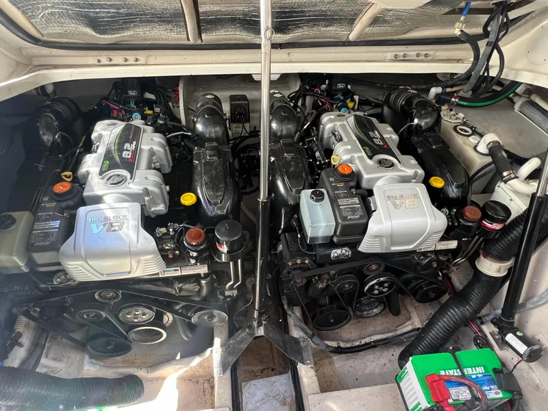 Slide: The Image of 2014 Sea Ray 350 Sundancer engine compartment with twin engines. - 23