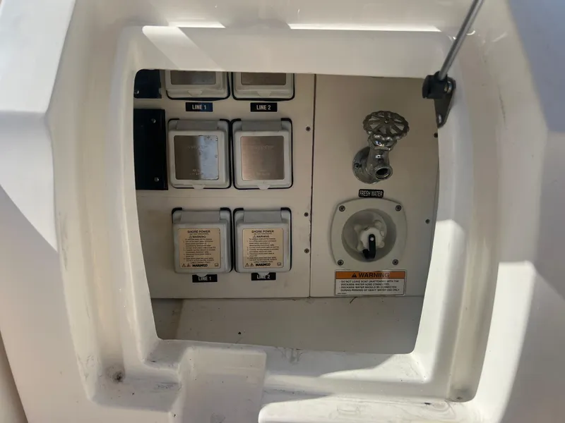 Slide: The Image of Electrical control panel on a 2014 Sea Ray 350 Sundancer boat. - 25