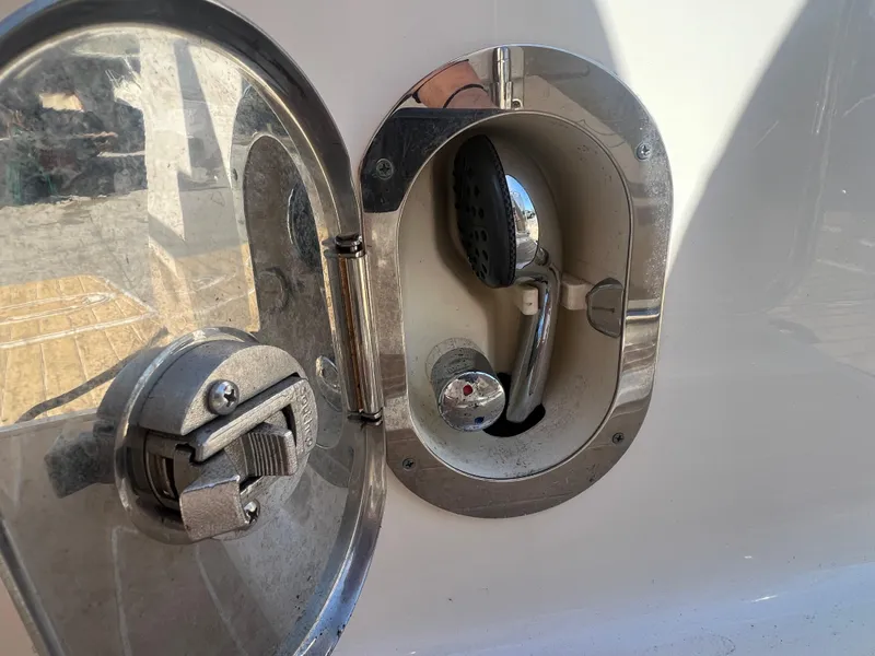 Slide: The Image of Close-up of 2014 Sea Ray 350 Sundancer boat shower handle and water outlet. - 27