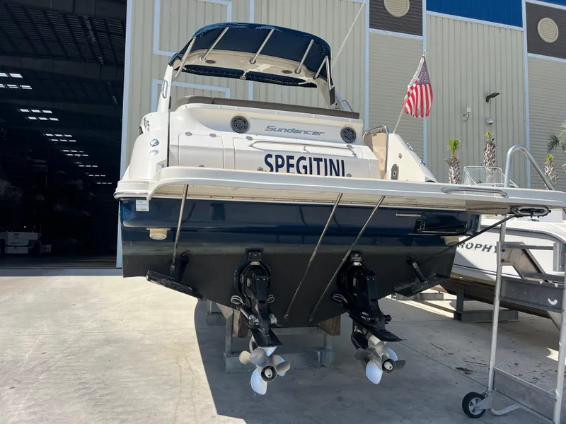 Slide: The Image of 2014 Sea Ray 350 Sundancer boat docked with dual propellers. - 3