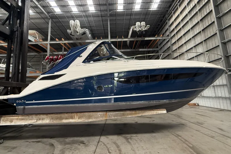 Slide: The Image of 2014 Sea Ray Sundancer 350 boat in indoor storage facility. - 47