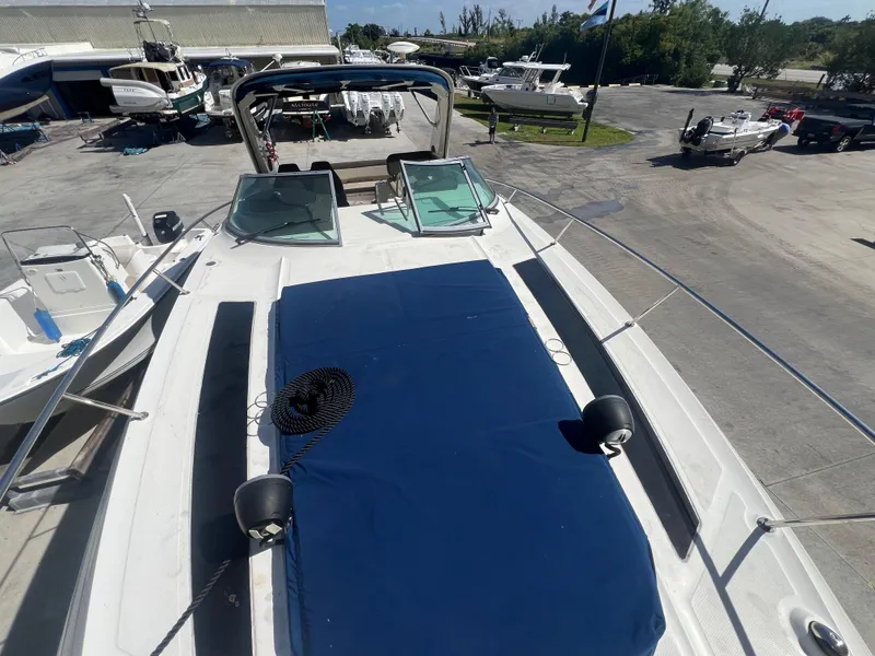 Slide: The Image of 2014 Sea Ray 350 Sundancer yacht with blue deck cover in marina. - 6