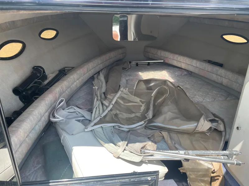 Slide: The Image of Interior cabin of a 1995 Sport-Craft 2500 AVANZA boat with seating and storage. - 8